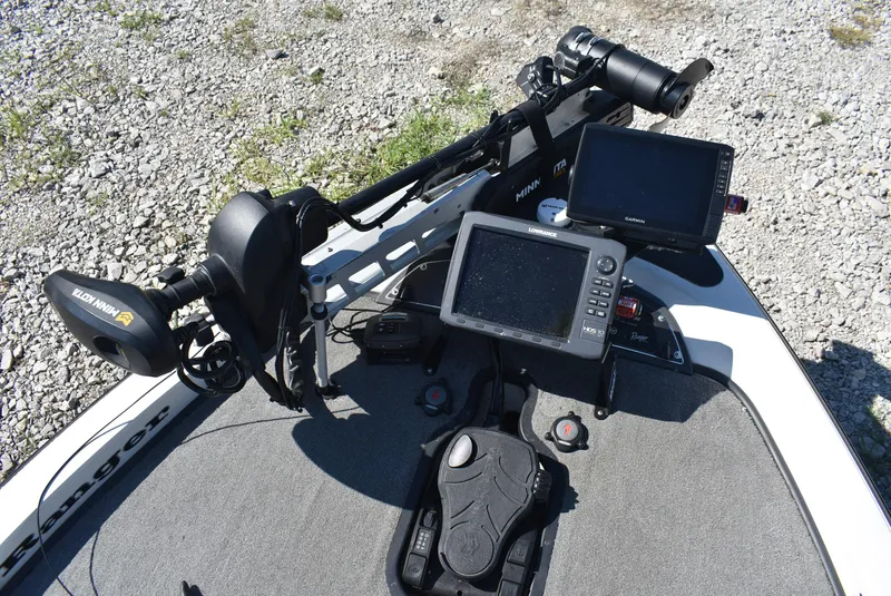 Slide: The Image of 2011 Ranger Z521 Comanche boat dashboard with electronics and trolling motor. - 10
