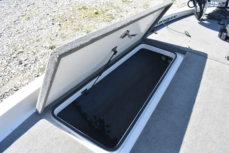 Slide: The Image of Open storage compartment on 2011 Ranger Z521 Comanche boat, showing interior space. - 17