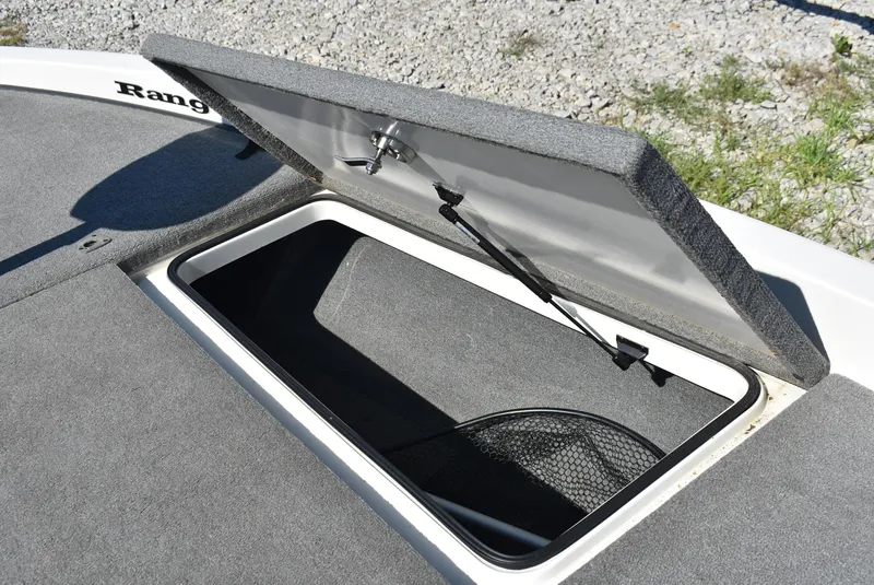 Slide: The Image of Open storage compartment on 2011 Ranger Z521 Comanche boat, showing interior details. - 20