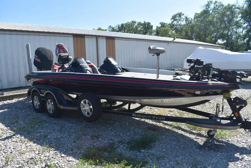 Slide: The Image of 2011 Ranger Z521 Comanche bass boat on trailer, parked outdoors near a storage building. - 6