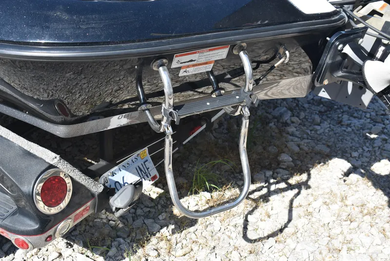 Slide: The Image of 2011 Ranger Z521 Comanche boat rear with ladder and Kansas license plate. - 8