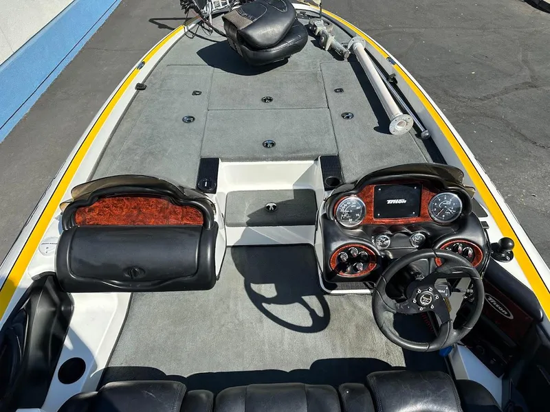 Slide: The Image of 2004 Triton Tr-20XDC boat interior with dual consoles and steering wheel. - 13