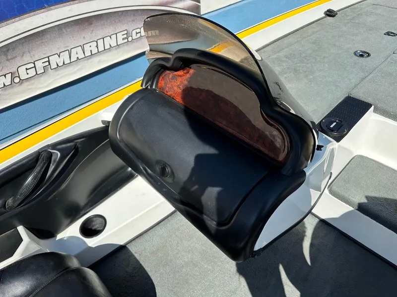 Slide: The Image of 2004 Triton Tr-20XDC boat dashboard with windshield and seating area. - 15