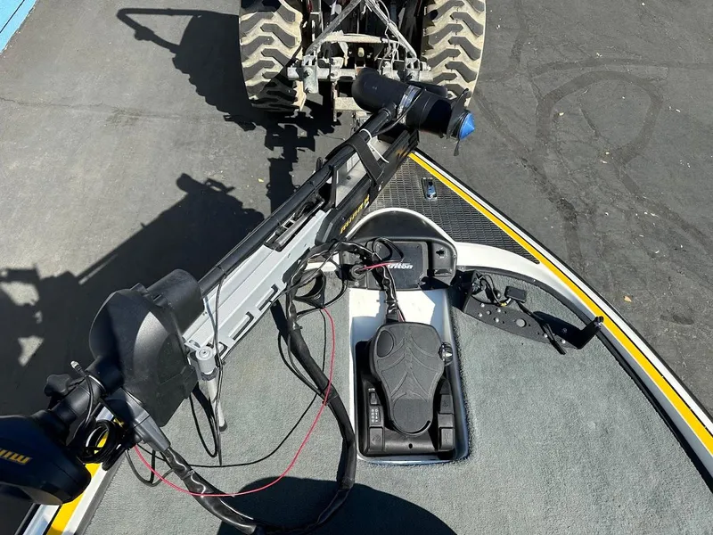 Slide: The Image of 2004 Triton Tr-20XDC boat with trolling motor and control panel on deck. - 26