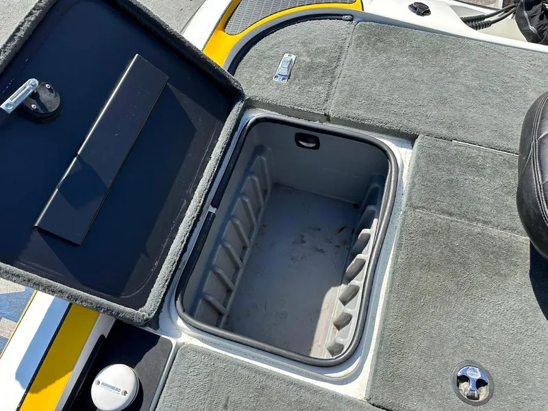 Slide: The Image of Open storage compartment on 2004 Triton Tr-20XDC boat deck. - 33
