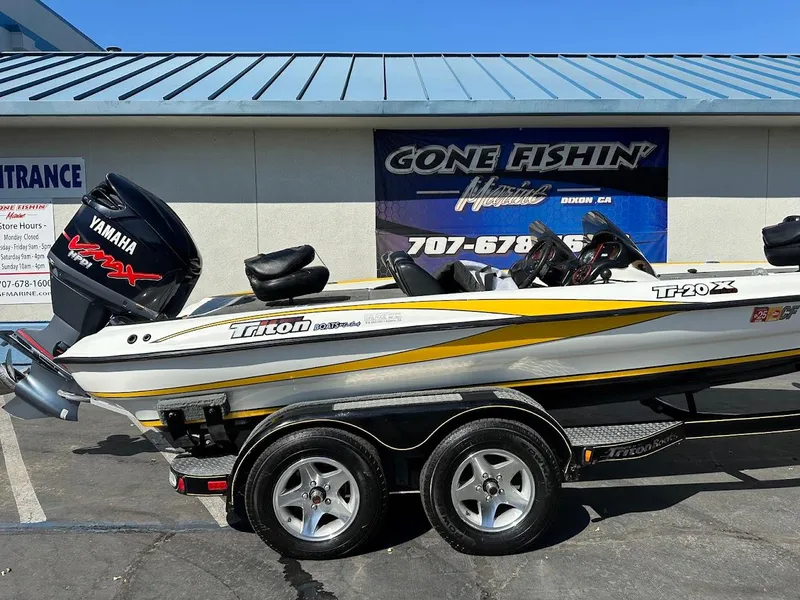 Slide: The Image of 2004 Triton Tr-20XDC boat with Yamaha engine, parked outside Gone Fishin' Marine. - 6