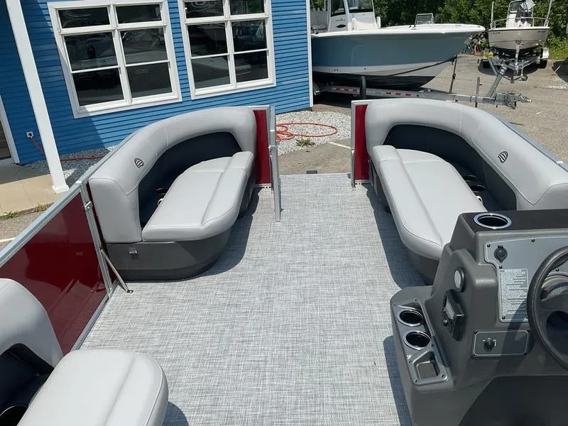 Slide: The Image of 2026 Sun Tracker PB 16 DLX pontoon boat interior with gray seating and modern console. - 11