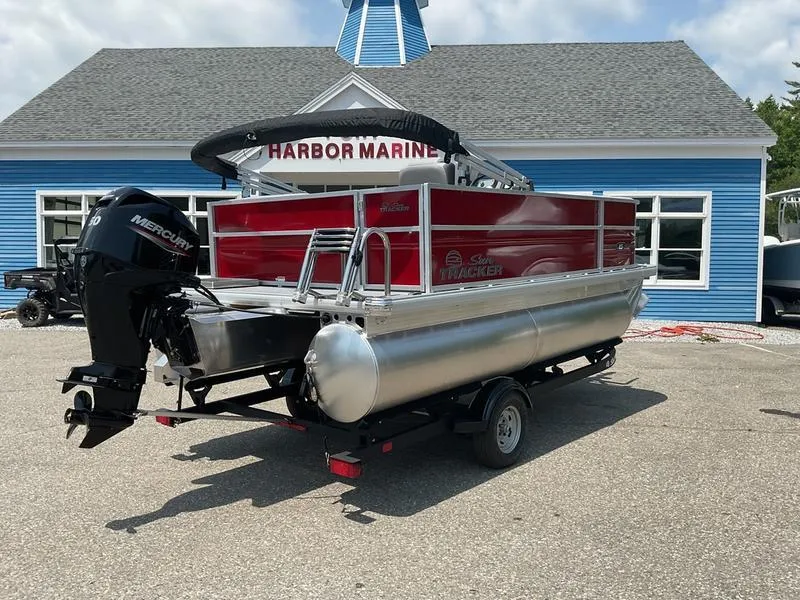 Slide: The Image of 2026 Sun Tracker PB 16 DLX pontoon boat on trailer at Harbor Marine. - 5