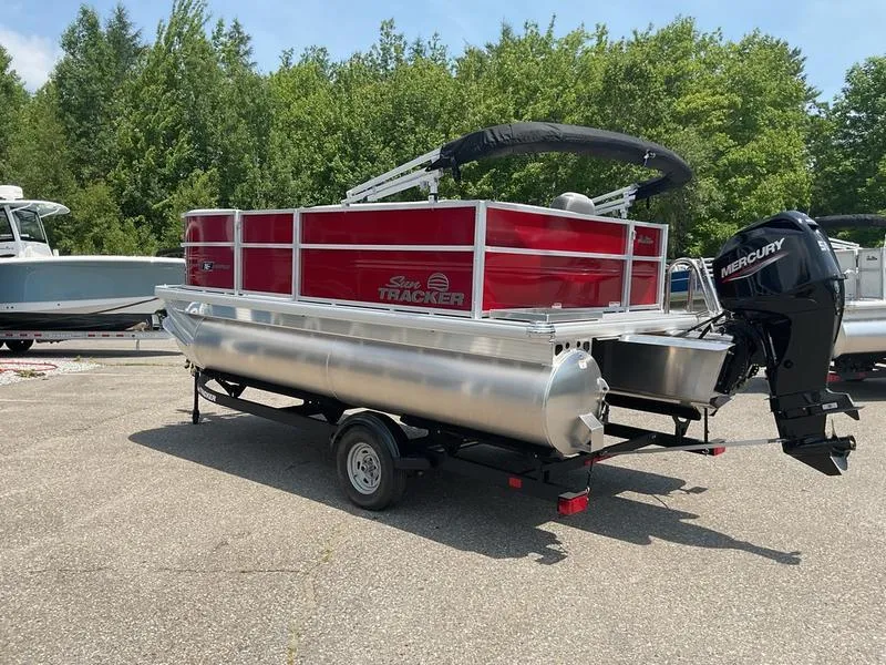 Slide: The Image of 2026 Sun Tracker PB 16 DLX pontoon boat with Mercury outboard motor on trailer. - 8
