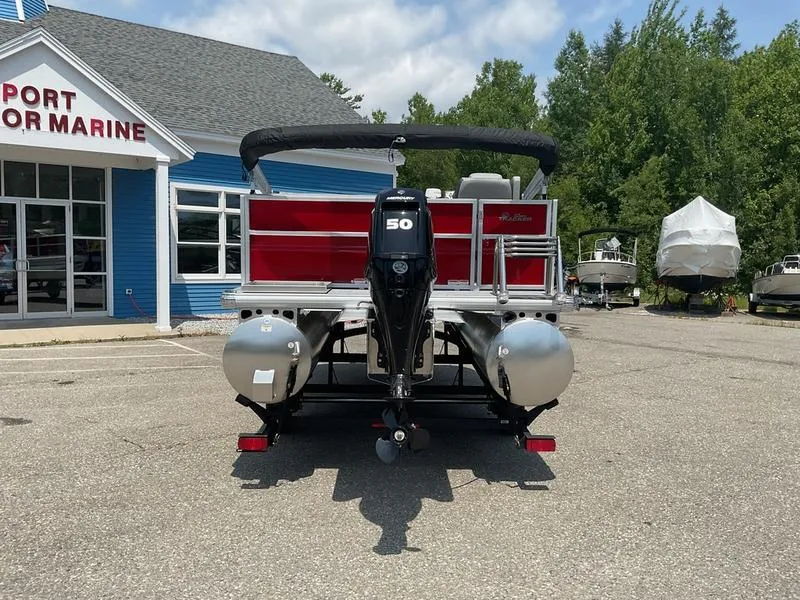 Slide: The Image of 2026 Sun Tracker PB 16 DLX pontoon boat at marina, rear view. - 9