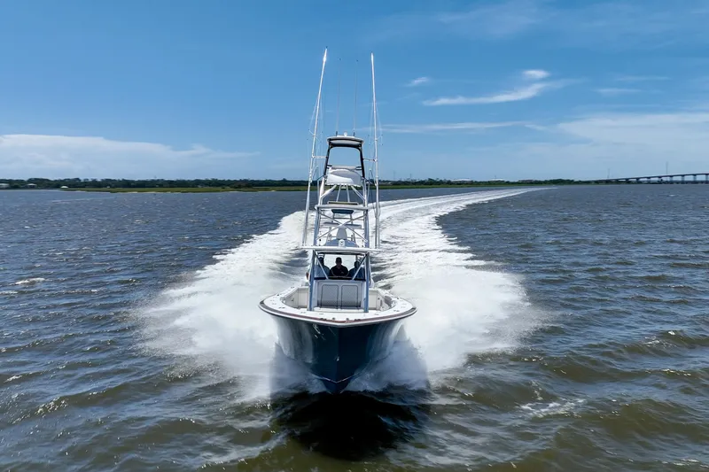 Slide: The Image of 2022 Valhalla Boatworks V41 cruising on open water under clear blue skies. - 10