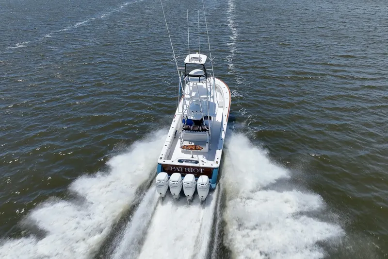 Slide: The Image of 2022 Valhalla Boatworks V41 speeding on open water, rear view. - 11