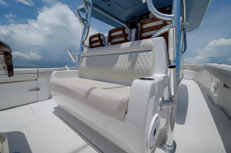 Slide: The Image of 2022 Valhalla Boatworks V41 interior with cushioned seating and stainless steel accents. - 16