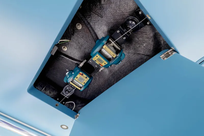 Slide: The Image of 2022 Valhalla Boatworks V41 equipment compartment with blue interior and mechanical components. - 22