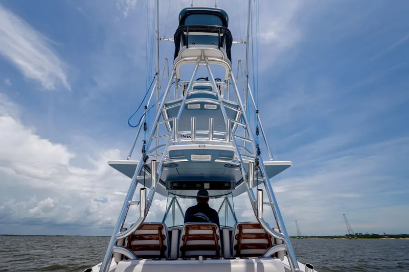 Slide: The Image of 2022 Valhalla Boatworks V41 on water, viewed from rear, under a clear sky. - 23