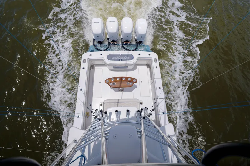Slide: The Image of 2022 Valhalla Boatworks V41 with four engines cruising on water, aerial view. - 27