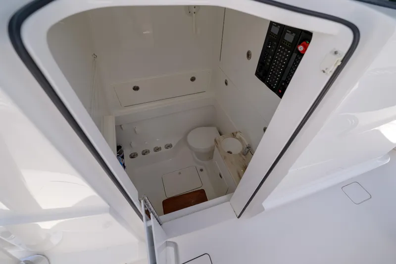 Slide: The Image of 2022 Valhalla Boatworks V41 interior cabin with toilet and control panel. - 28