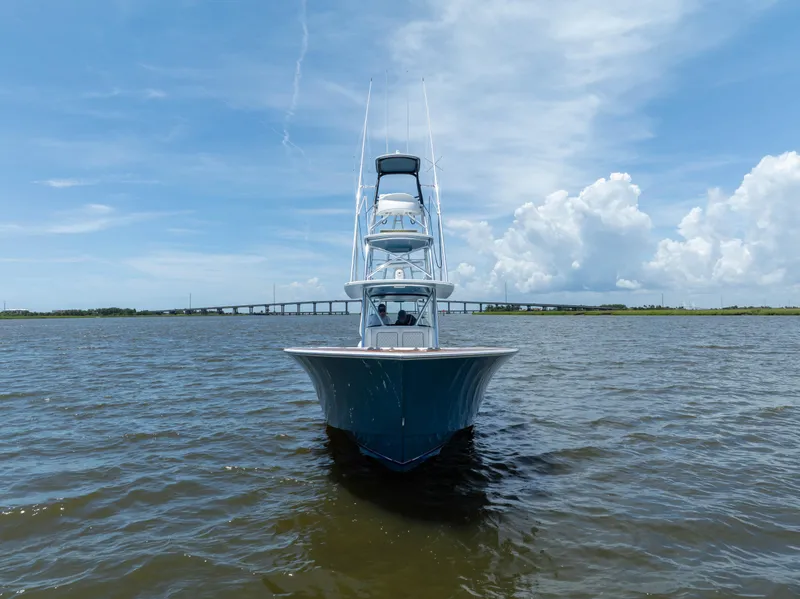 Slide: The Image of 2022 Valhalla Boatworks V41 on open water, clear sky, bridge in background. - 3