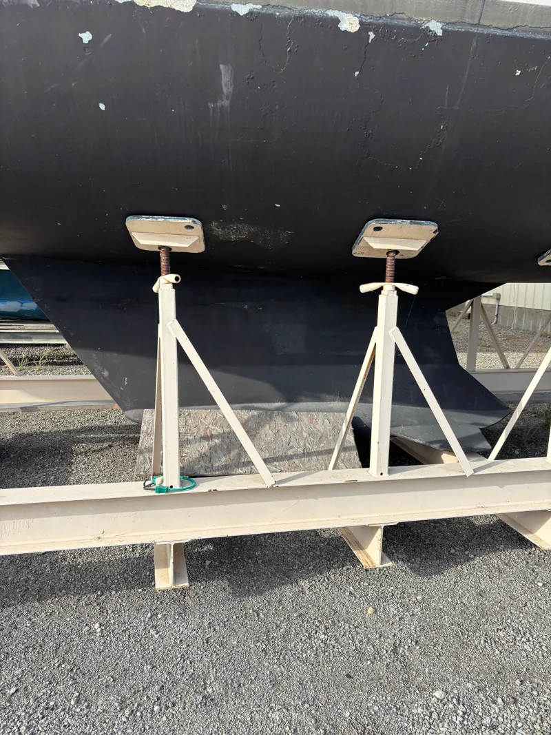 Slide: The Image of Bottom view of a 2001 Hunter 460 sailboat hull supported by stands. - 10