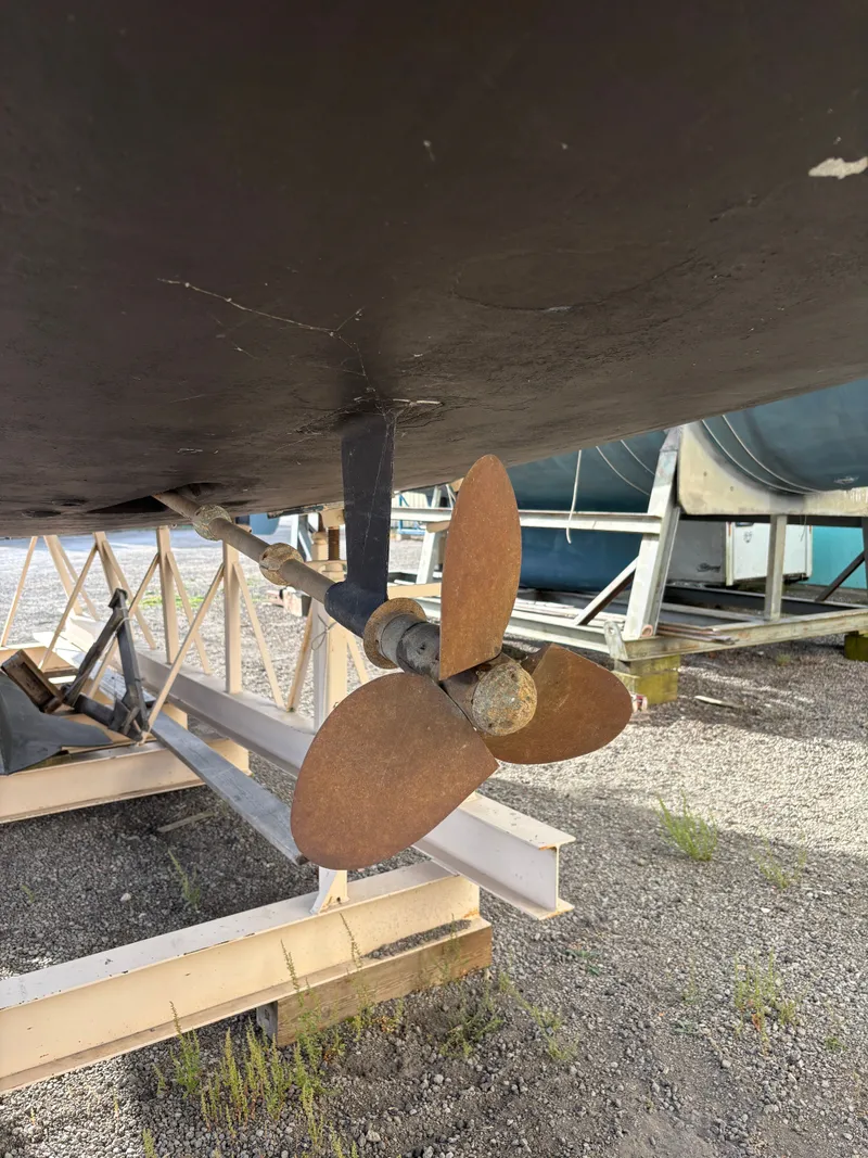 Slide: The Image of Rusty propeller of a 2001 Hunter 460 sailboat on a stand. - 11