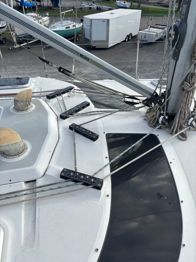 Slide: The Image of Deck of 2001 Hunter 460 sailboat with rigging and ropes. - 14