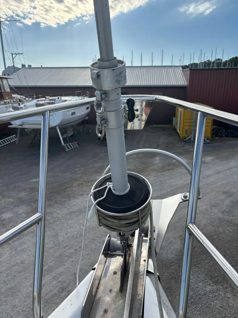 Slide: The Image of Bow of a 2001 Hunter 460 sailboat with furler system, docked in a marina. - 17