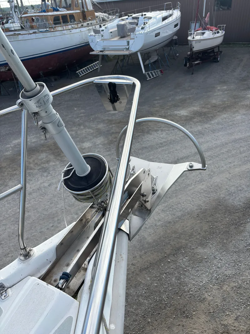 Slide: The Image of Bow of a 2001 Hunter 460 sailboat with anchor, in a boatyard. - 18