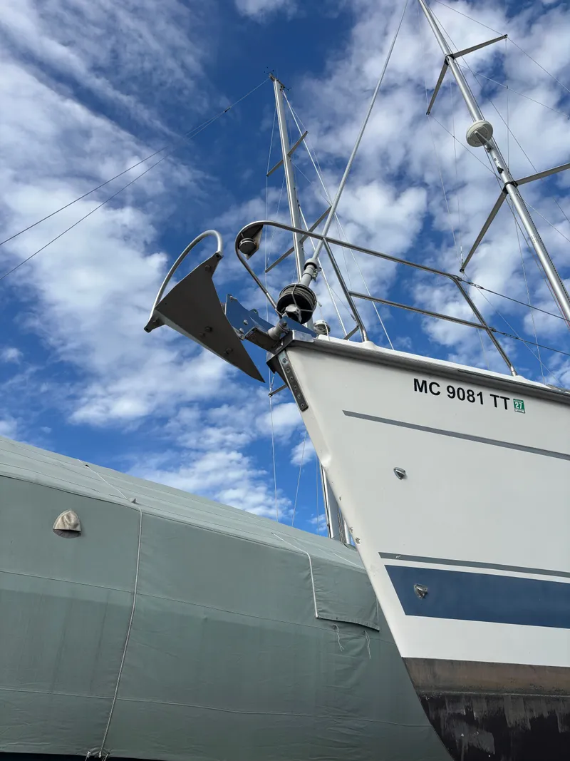 Slide: The Image of Sailboat Hunter 460, 2001 model, docked with blue sky background. - 2