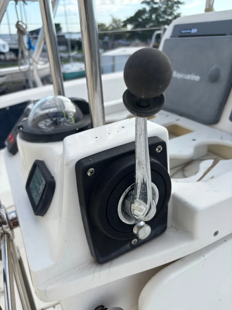 Slide: The Image of Close-up of a 2001 Hunter 460 sailboat throttle control in the cockpit. - 33