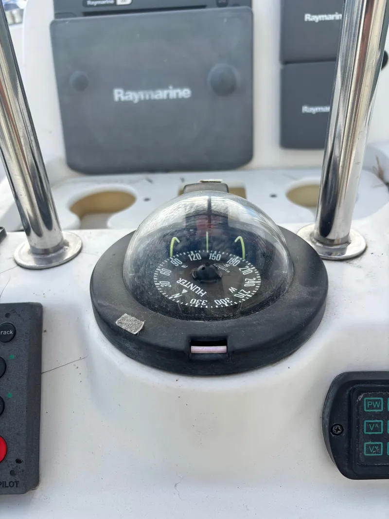 Slide: The Image of Compass and navigation equipment on a 2001 Hunter 460 sailboat. - 35
