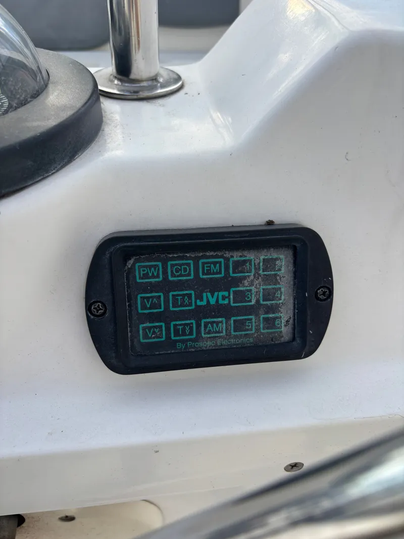 Slide: The Image of JVC control panel on a 2001 Hunter 460 boat dashboard. - 36