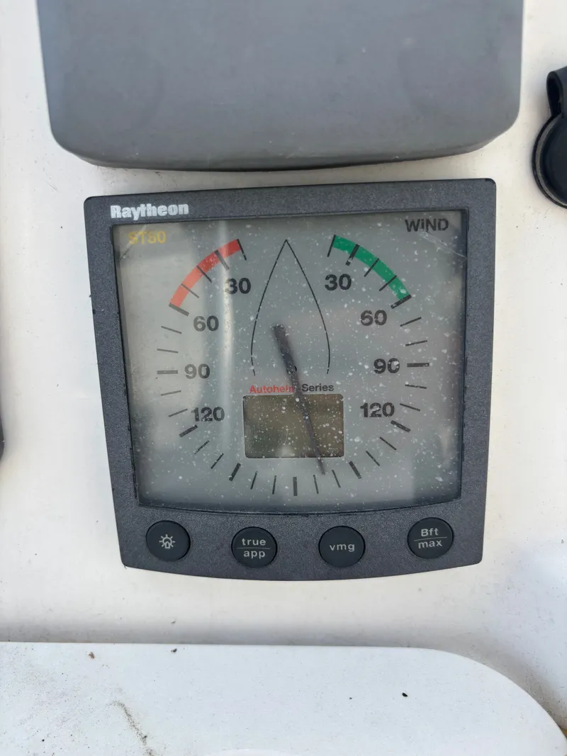 Slide: The Image of Raytheon wind gauge on a 2001 Hunter 460 sailboat dashboard. - 39