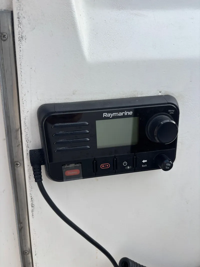 Slide: The Image of Raymarine marine radio on a 2001 Hunter 460 sailboat dashboard. - 40