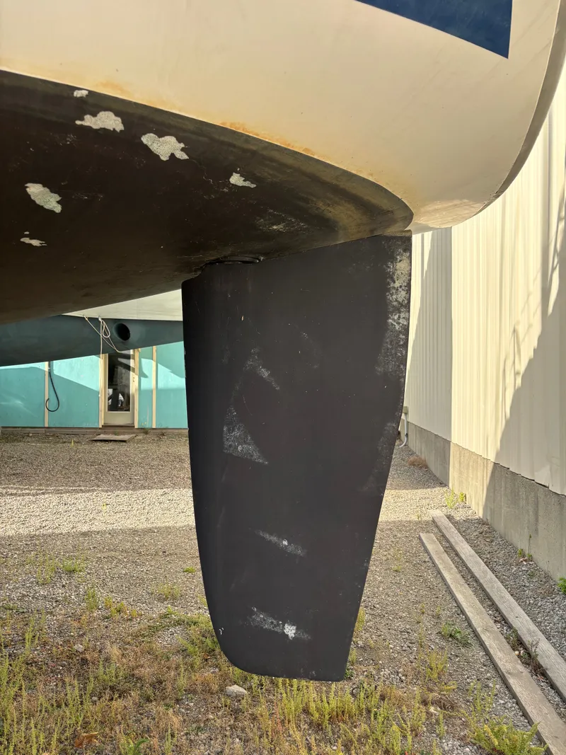 Slide: The Image of Keel of a 2001 Hunter 460 sailboat on dry land. - 9