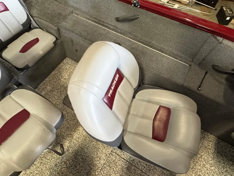 Slide: The Image of 2014 Tracker Pro Guide V-175 Combo boat interior with gray and red seating. - 10