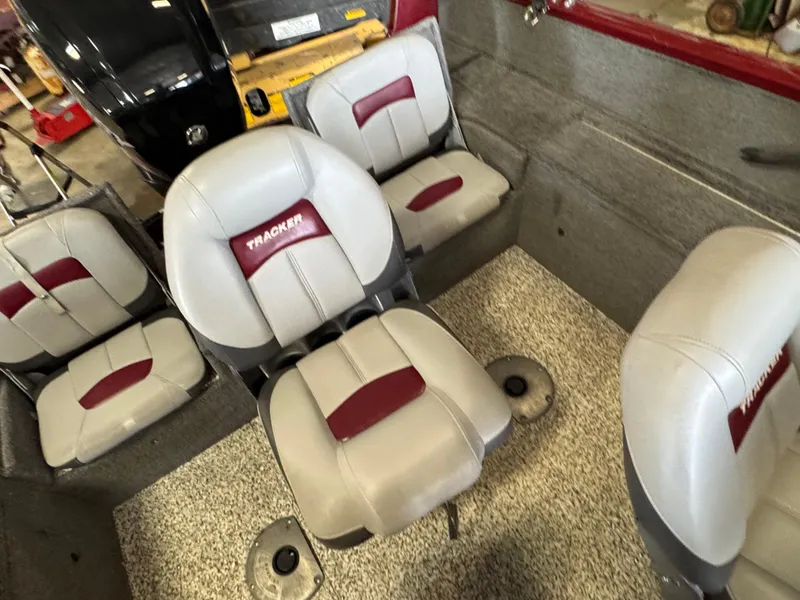 Slide: The Image of 2014 Tracker Pro Guide V-175 Combo boat interior with gray and red seating. - 11