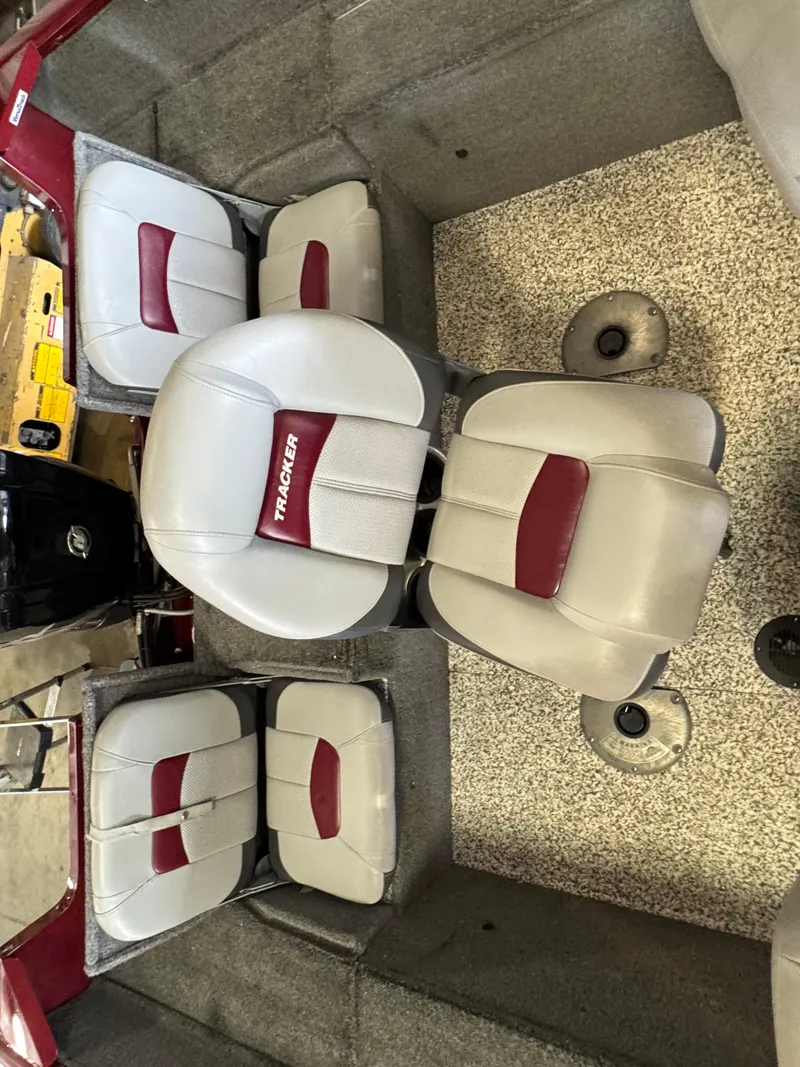 Slide: The Image of 2014 Tracker Pro Guide V-175 Combo boat seats with red and white upholstery. - 6