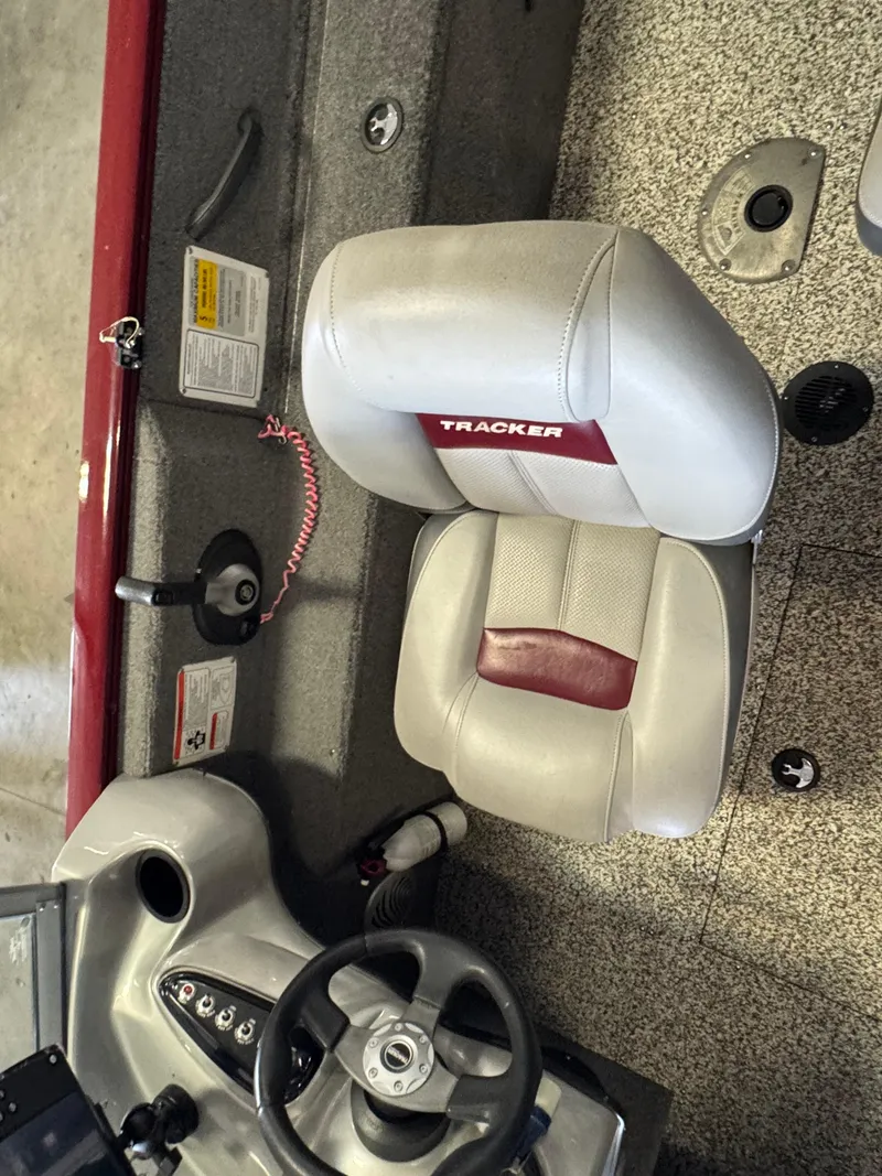 Slide: The Image of 2014 Tracker Pro Guide V-175 Combo boat interior with steering wheel and seat. - 7