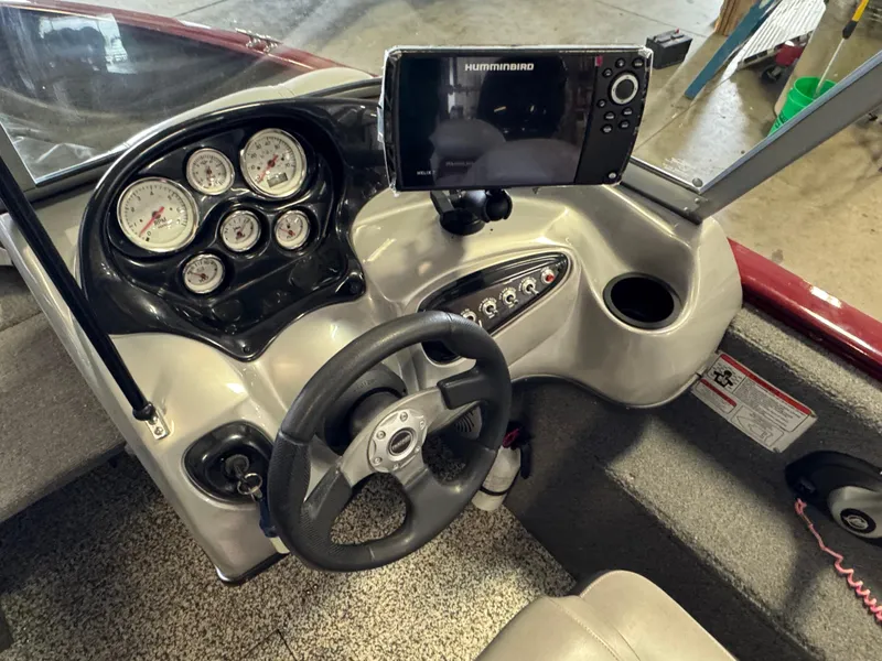 Slide: The Image of 2014 Tracker Pro Guide V-175 Combo dashboard with steering wheel and Humminbird fishfinder. - 8