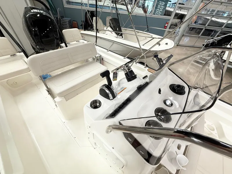 Slide: The Image of 2025 Boston Whaler 170 Montauk interior with steering console and seating. - 4