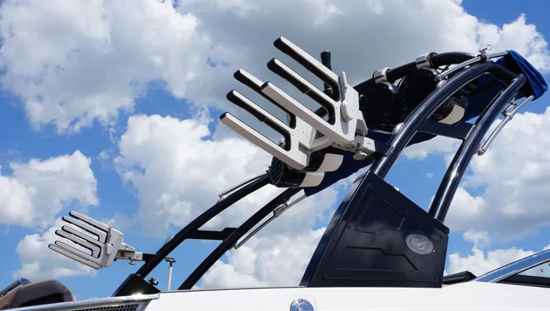 Slide: The Image of 2022 Cobalt R6 boat with wakeboard racks against a cloudy sky. - 12