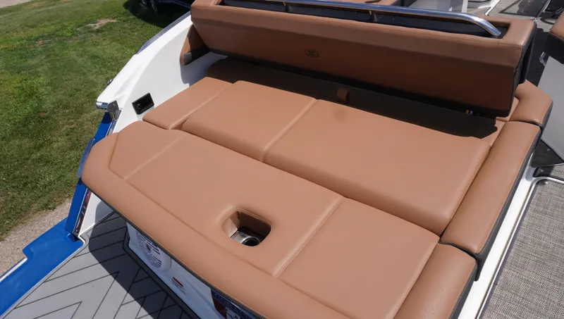 Slide: The Image of 2022 Cobalt R6 boat with tan leather seating and integrated cup holder. - 14