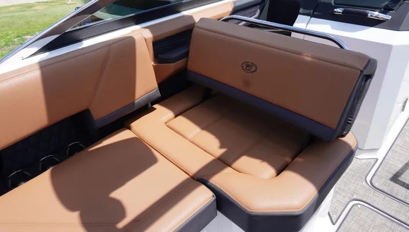 Slide: The Image of 2022 Cobalt R6 boat interior with tan leather seating and sleek design. - 19