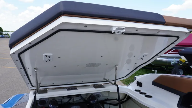 Slide: The Image of 2022 Cobalt R6 boat storage compartment open, showcasing interior details and design. - 22