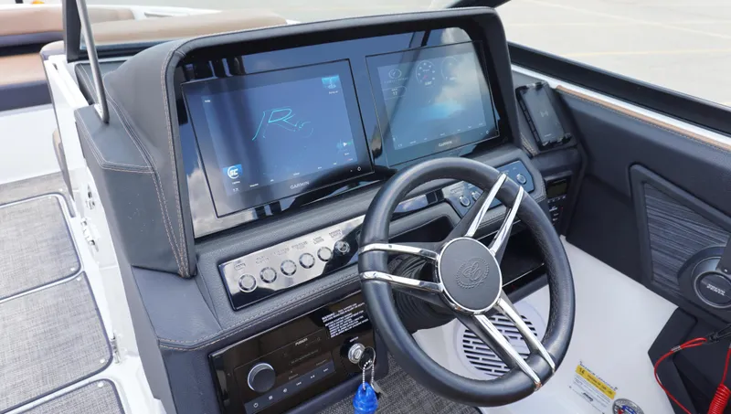 Slide: The Image of 2022 Cobalt R6 boat dashboard with steering wheel and digital displays. - 26