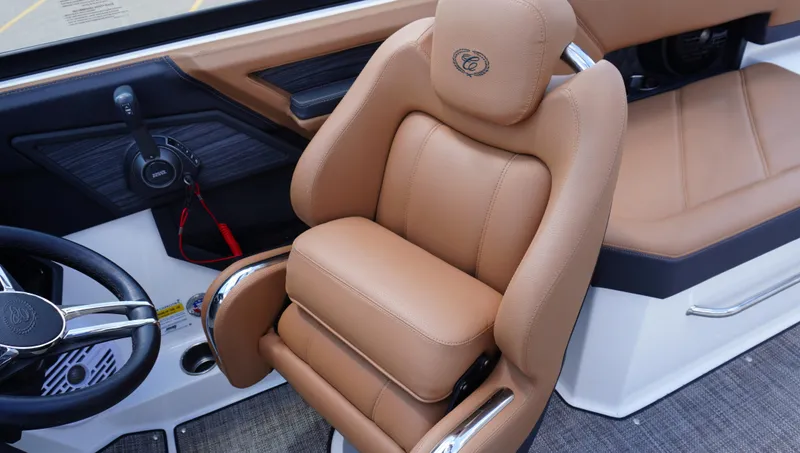 Slide: The Image of 2022 Cobalt R6 boat interior with tan leather seating and steering wheel. - 27