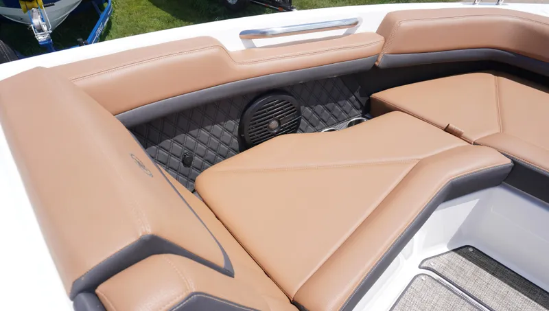 Slide: The Image of 2022 Cobalt R6 boat interior with tan leather seating and quilted accents. - 29