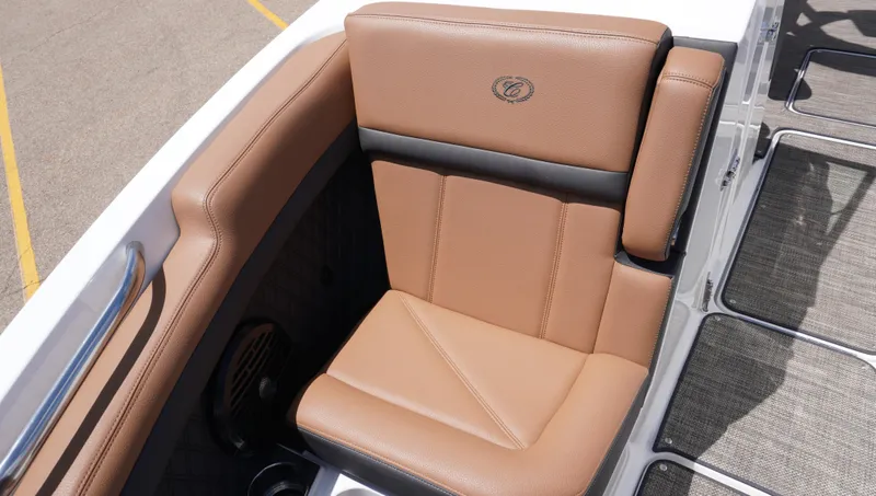 Slide: The Image of 2022 Cobalt R6 boat seat with tan leather upholstery and logo detail. - 31