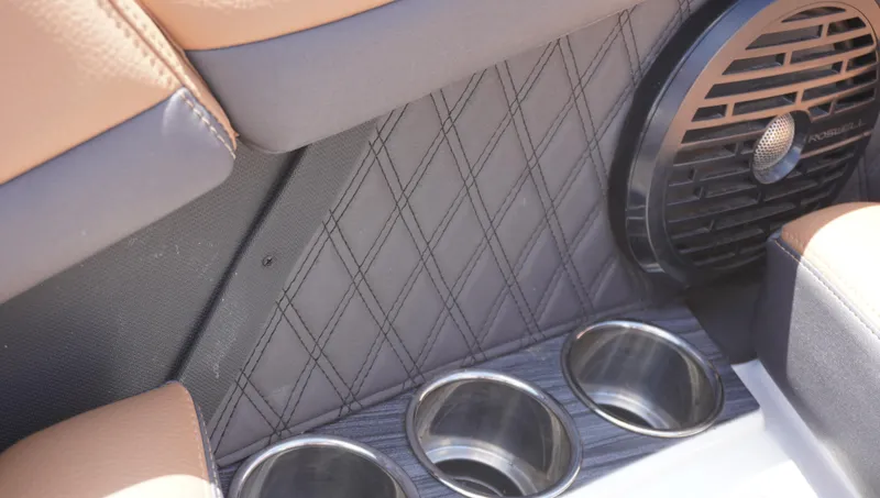 Slide: The Image of 2022 Cobalt R6 interior with cup holders and speaker detail. - 32