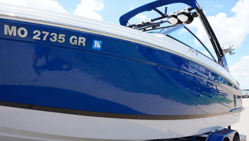 Slide: The Image of 2022 Cobalt R6 boat with blue hull and registration number MO 2735 GR. - 5